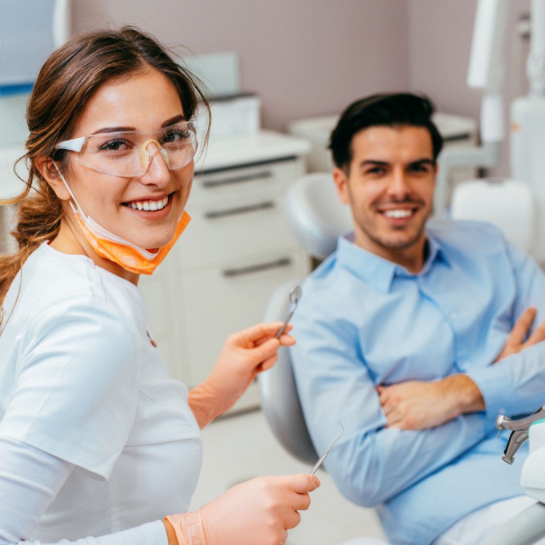 happy dentist and patient