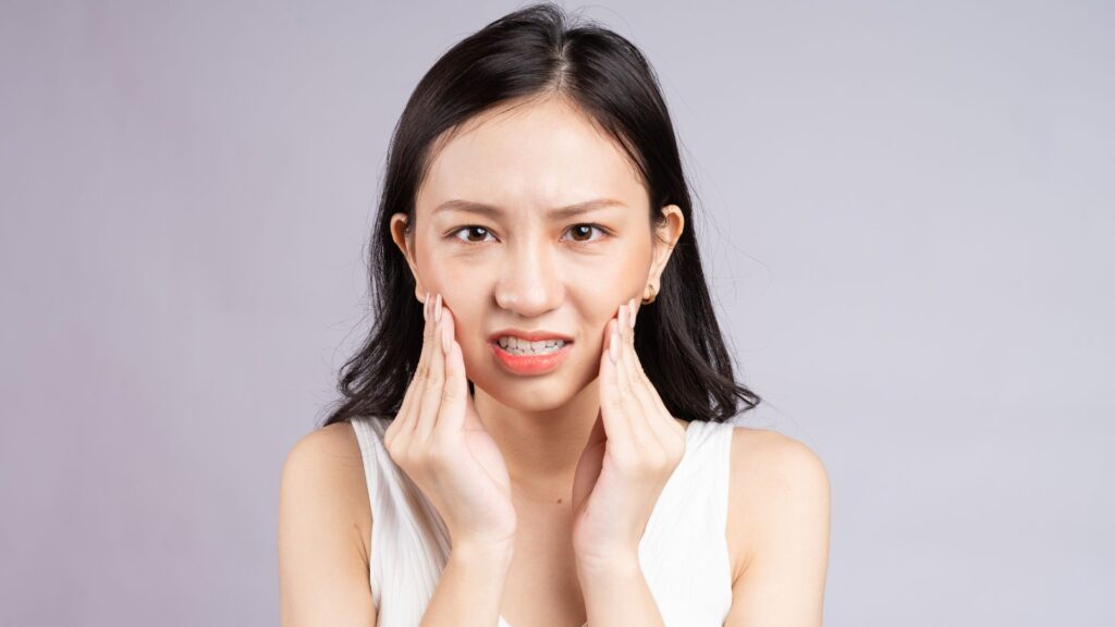 woman with tooth pain