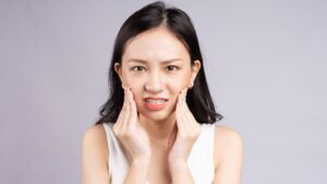 woman with tooth pain