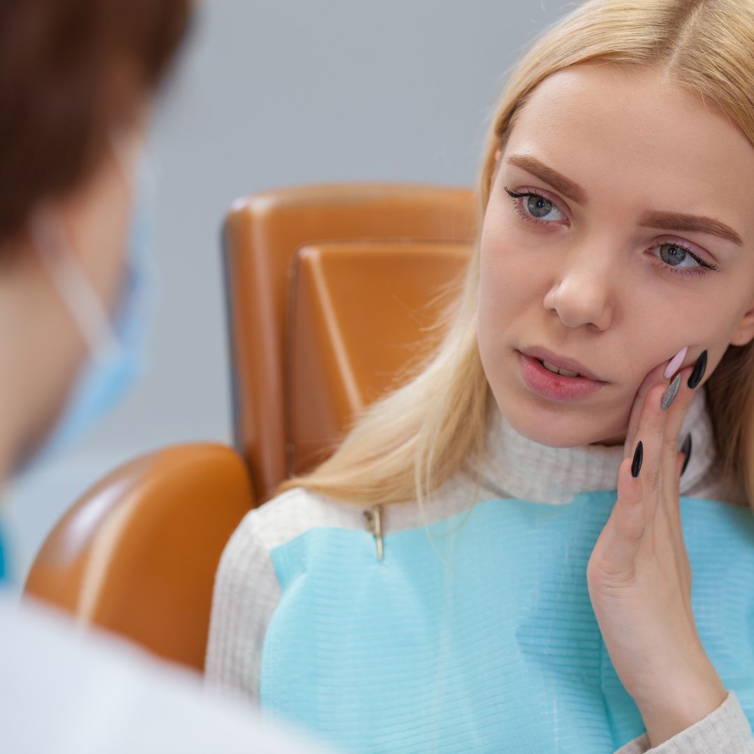 woman speaking with dentist