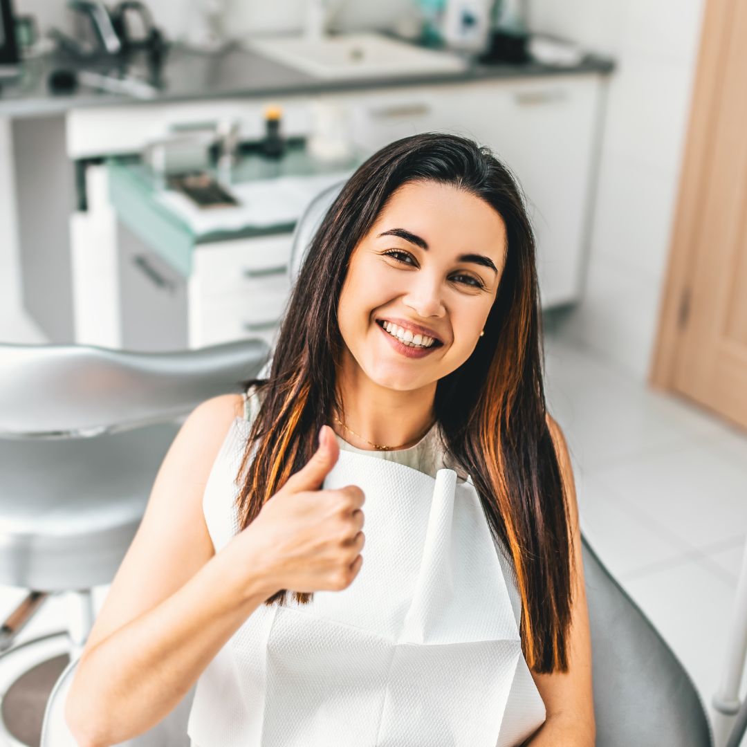 smiling woman in dentist chair