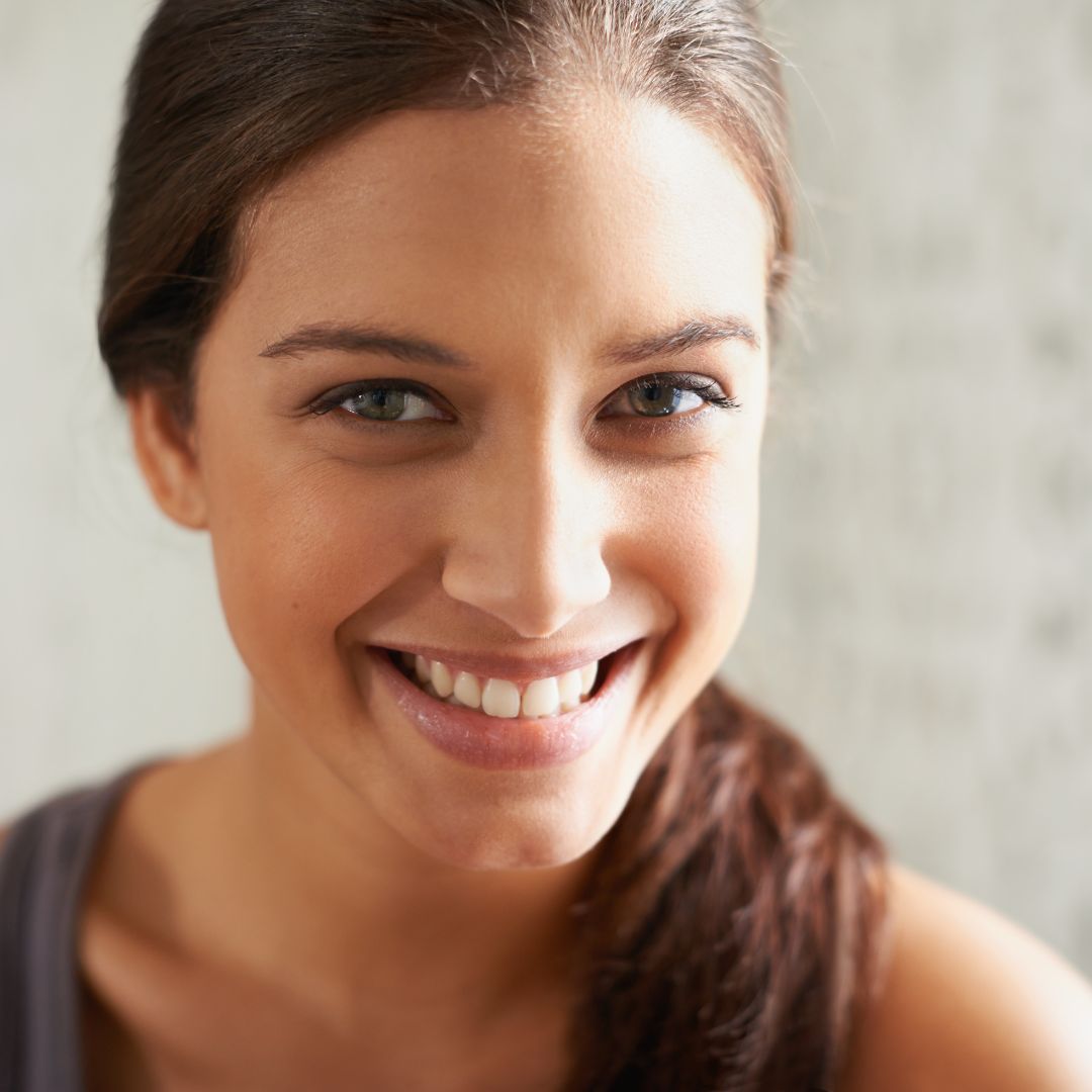 young woman with confident smile