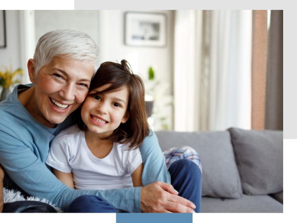 senior woman smiling with granddaughter