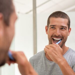 Man brushing teeth