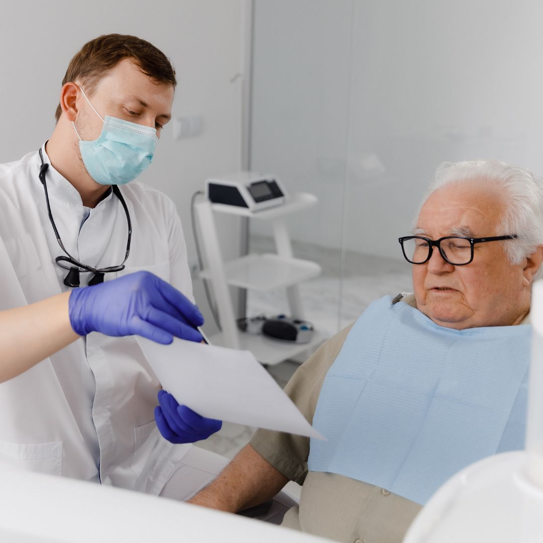 Dentist talking to patient