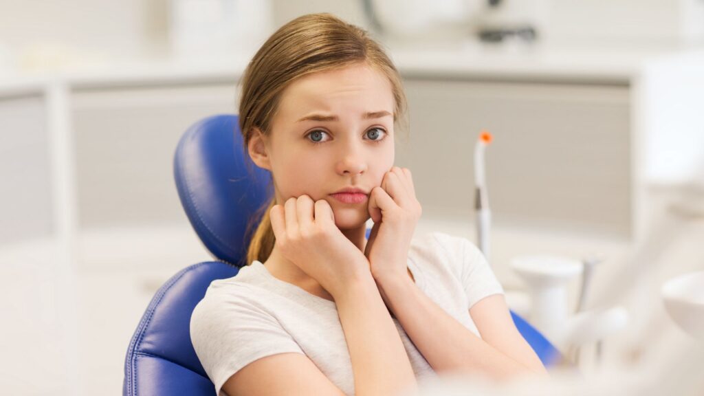 Female dental patient worried from dental anxiety