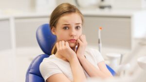 Female dental patient worried from dental anxiety