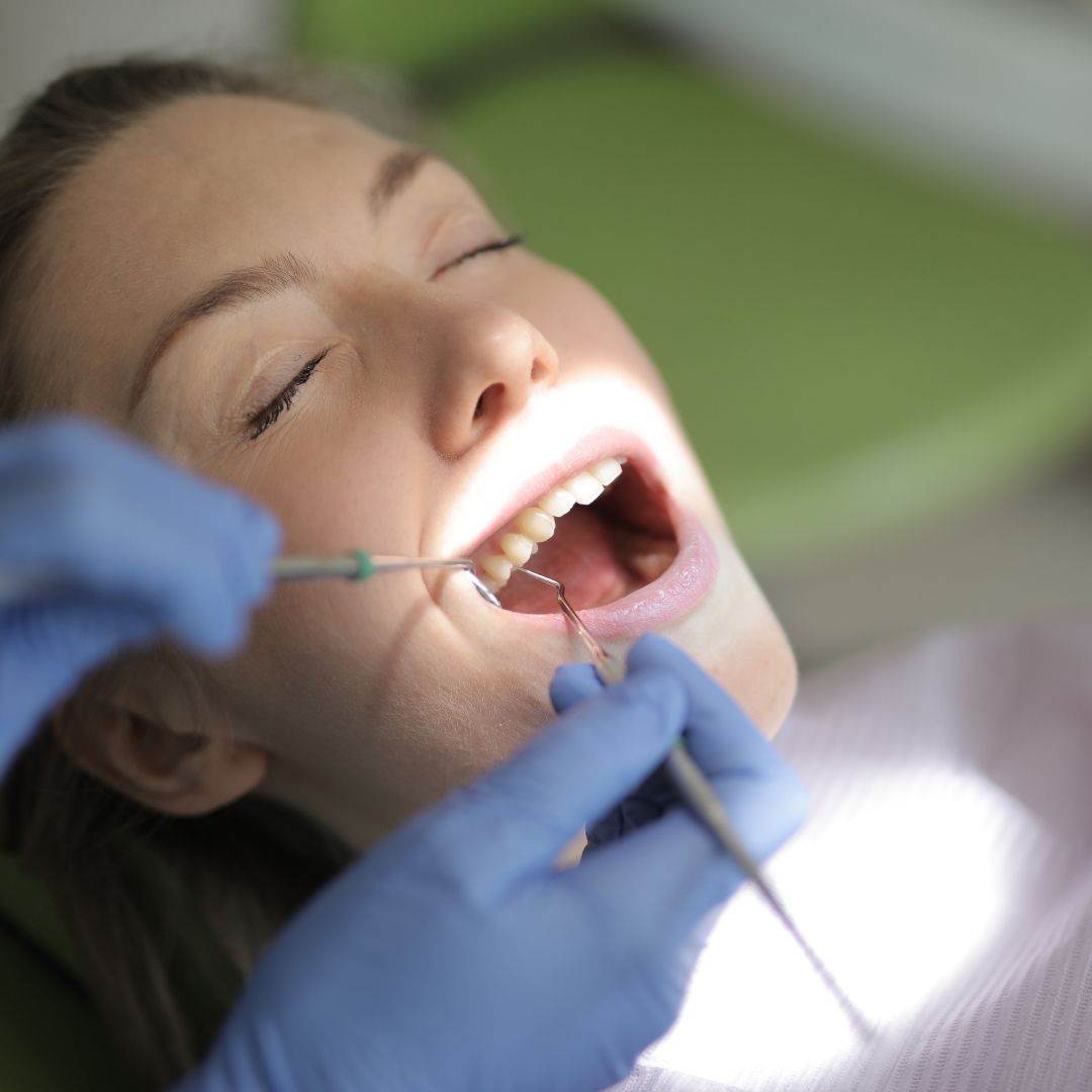 Person getting their teeth cleaned
