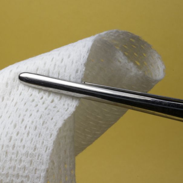 Cutting a piece of gauze